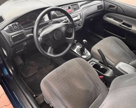 Синій Міцубісі Lancer, об'ємом двигуна 1.6 л та пробігом 220 тис. км за 2399 $, фото 3 на Automoto.ua