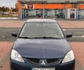 Синій Міцубісі Lancer, об'ємом двигуна 1.6 л та пробігом 220 тис. км за 2399 $, фото 5 на Automoto.ua