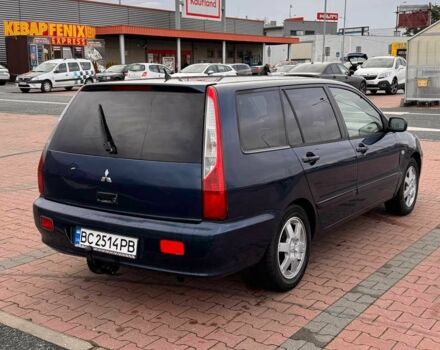 Синій Міцубісі Lancer, об'ємом двигуна 1.6 л та пробігом 220 тис. км за 2399 $, фото 2 на Automoto.ua