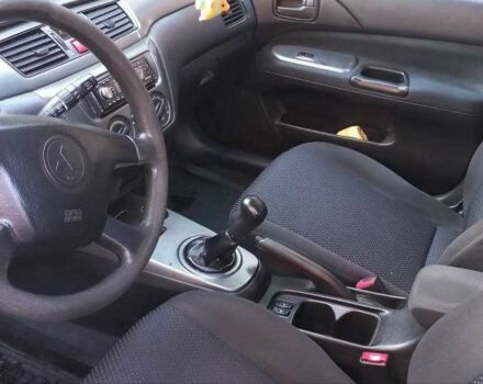Синій Міцубісі Lancer, об'ємом двигуна 1.6 л та пробігом 245 тис. км за 3299 $, фото 8 на Automoto.ua