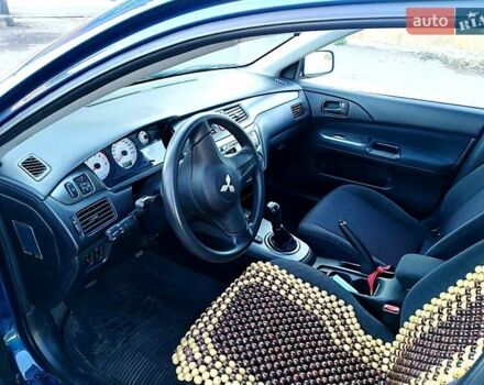 Мицубиси Лансер 2006 в Могилев-Подольском на Automoto.ua Синий Мицубиси Лансер, объемом двигателя 1.6 л и пробегом 221 тыс. км за 4700 $, фото 25 на Automoto.ua