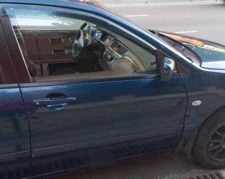 Синій Міцубісі Lancer, об'ємом двигуна 1.6 л та пробігом 245 тис. км за 3299 $, фото 5 на Automoto.ua
