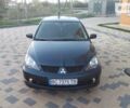 Синій Міцубісі Lancer, об'ємом двигуна 2 л та пробігом 211 тис. км за 4200 $, фото 1 на Automoto.ua