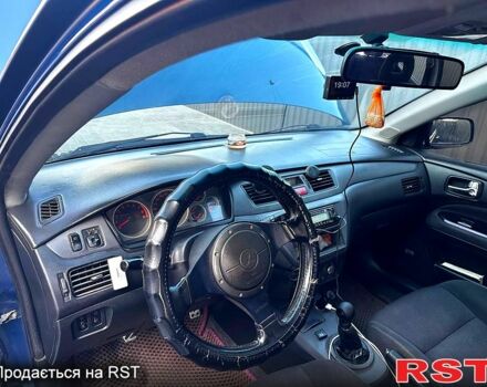 Синий Мицубиси Лансер, объемом двигателя 2 л и пробегом 330 тыс. км за 3400 $, фото 2 на Automoto.ua