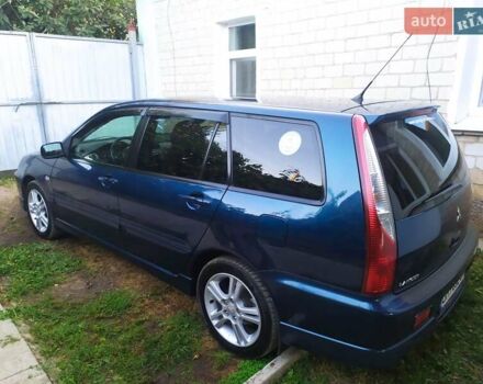 Синій Міцубісі Lancer, об'ємом двигуна 2 л та пробігом 201 тис. км за 4800 $, фото 4 на Automoto.ua