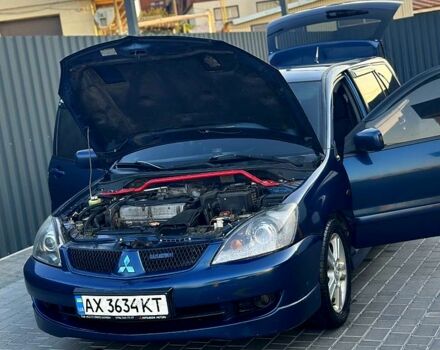 Синий Мицубиси Лансер, объемом двигателя 2 л и пробегом 330 тыс. км за 3400 $, фото 4 на Automoto.ua