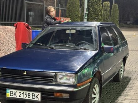 Синий Мицубиси Лансер, объемом двигателя 1.5 л и пробегом 170 тыс. км за 650 $, фото 1 на Automoto.ua