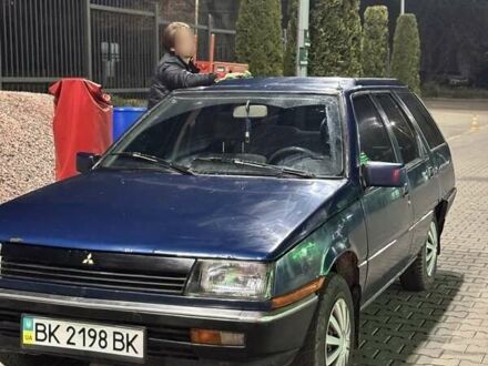 Синий Мицубиси Лансер, объемом двигателя 1.5 л и пробегом 170 тыс. км за 650 $, фото 1 на Automoto.ua