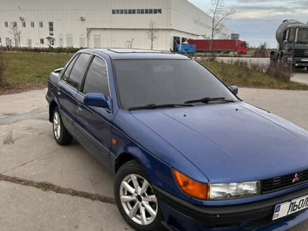 Синий Мицубиси Лансер, объемом двигателя 1.8 л и пробегом 245 тыс. км за 3000 $, фото 1 на Automoto.ua