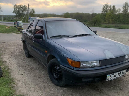 Синій Міцубісі Lancer, об'ємом двигуна 1.5 л та пробігом 352 тис. км за 1100 $, фото 1 на Automoto.ua