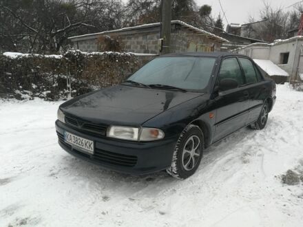 Синий Мицубиси Лансер, объемом двигателя 1.3 л и пробегом 250 тыс. км за 1450 $, фото 1 на Automoto.ua