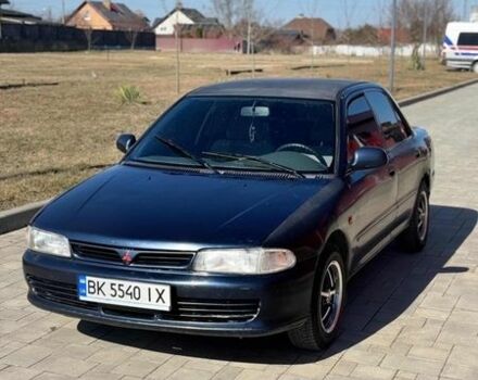 Синий Мицубиси Лансер, объемом двигателя 1.3 л и пробегом 370 тыс. км за 1600 $, фото 1 на Automoto.ua