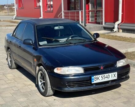 Синий Мицубиси Лансер, объемом двигателя 1.3 л и пробегом 379 тыс. км за 1600 $, фото 1 на Automoto.ua