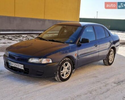 Синий Мицубиси Лансер, объемом двигателя 1.5 л и пробегом 402 тыс. км за 1550 $, фото 1 на Automoto.ua