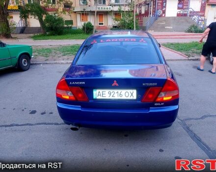Синий Мицубиси Лансер, объемом двигателя 1.3 л и пробегом 270 тыс. км за 2100 $, фото 1 на Automoto.ua