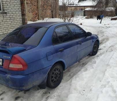 Синий Мицубиси Лансер, объемом двигателя 1.3 л и пробегом 450 тыс. км за 900 $, фото 1 на Automoto.ua