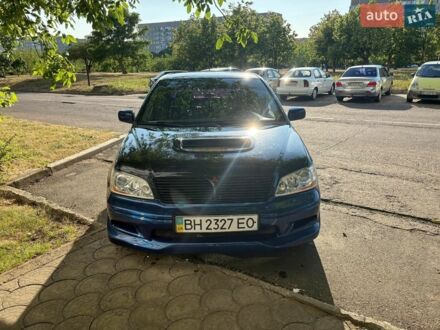 Синий Мицубиси Лансер, объемом двигателя 2 л и пробегом 228 тыс. км за 3500 $, фото 1 на Automoto.ua