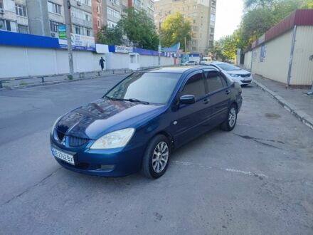 Синій Міцубісі Lancer, об'ємом двигуна 1.6 л та пробігом 257 тис. км за 3750 $, фото 1 на Automoto.ua