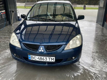 Синий Мицубиси Лансер, объемом двигателя 1.58 л и пробегом 234 тыс. км за 3500 $, фото 1 на Automoto.ua