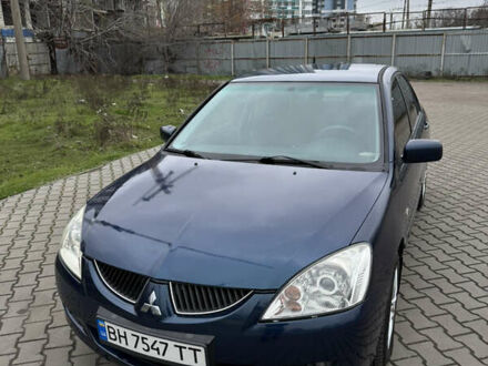 Синий Мицубиси Лансер, объемом двигателя 1.6 л и пробегом 200 тыс. км за 5000 $, фото 1 на Automoto.ua