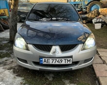 Синий Мицубиси Лансер, объемом двигателя 1.58 л и пробегом 260 тыс. км за 2400 $, фото 1 на Automoto.ua