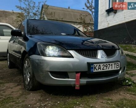 Синий Мицубиси Лансер, объемом двигателя 1.58 л и пробегом 300 тыс. км за 3300 $, фото 1 на Automoto.ua