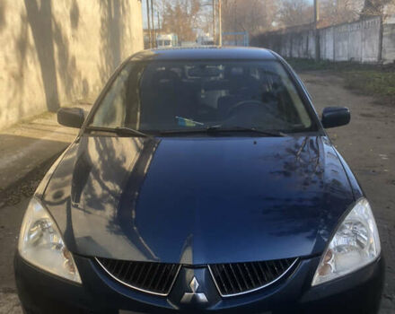 Синій Міцубісі Lancer, об'ємом двигуна 1.58 л та пробігом 346 тис. км за 4500 $, фото 1 на Automoto.ua
