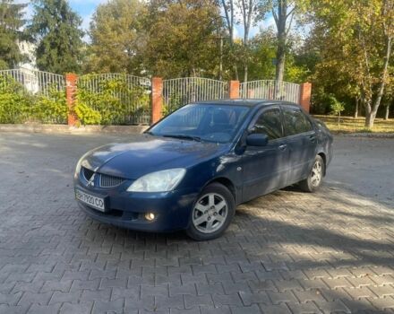 Синий Мицубиси Лансер, объемом двигателя 2 л и пробегом 237 тыс. км за 3499 $, фото 1 на Automoto.ua