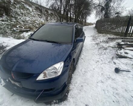 Синий Мицубиси Лансер, объемом двигателя 2 л и пробегом 320 тыс. км за 2700 $, фото 1 на Automoto.ua