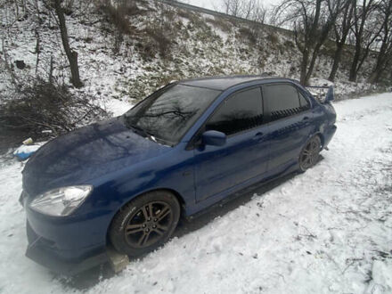 Синій Міцубісі Lancer, об'ємом двигуна 2 л та пробігом 320 тис. км за 2700 $, фото 1 на Automoto.ua