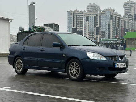 Синий Мицубиси Лансер, объемом двигателя 2 л и пробегом 335 тыс. км за 4200 $, фото 1 на Automoto.ua