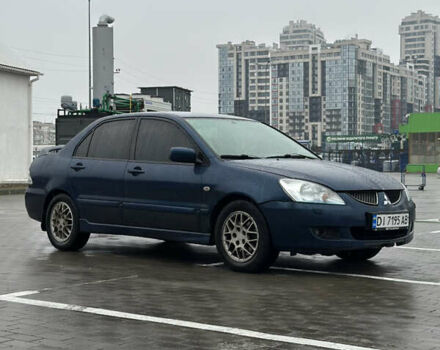 Синій Міцубісі Lancer, об'ємом двигуна 2 л та пробігом 335 тис. км за 4200 $, фото 1 на Automoto.ua