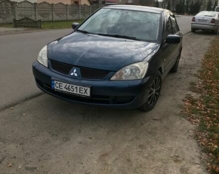 Синий Мицубиси Лансер, объемом двигателя 1.3 л и пробегом 265 тыс. км за 2900 $, фото 1 на Automoto.ua
