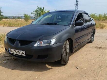 Синий Мицубиси Лансер, объемом двигателя 1.6 л и пробегом 360 тыс. км за 3000 $, фото 1 на Automoto.ua