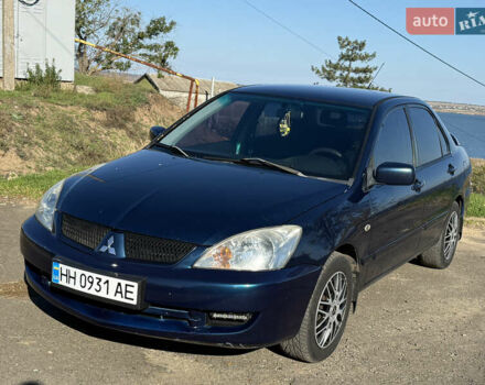 Синий Мицубиси Лансер, объемом двигателя 1.58 л и пробегом 269 тыс. км за 3350 $, фото 1 на Automoto.ua