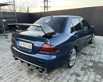 Синий Мицубиси Лансер, объемом двигателя 1.6 л и пробегом 241 тыс. км за 5500 $, фото 1 на Automoto.ua