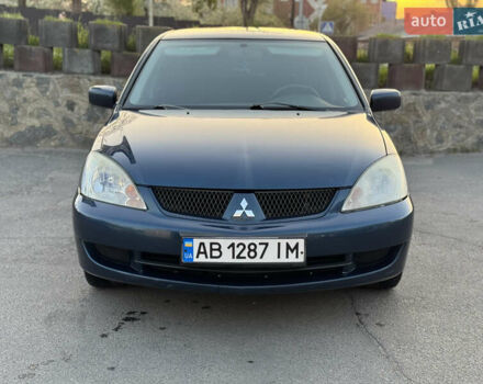 Синий Мицубиси Лансер, объемом двигателя 1.58 л и пробегом 300 тыс. км за 3650 $, фото 1 на Automoto.ua