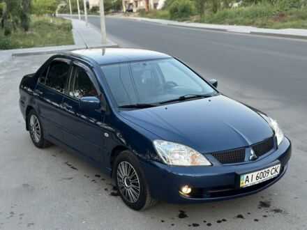 Синій Міцубісі Lancer, об'ємом двигуна 1.6 л та пробігом 115 тис. км за 5000 $, фото 1 на Automoto.ua