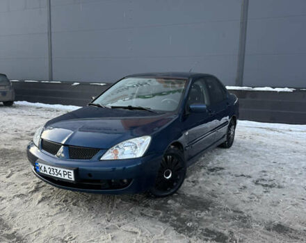 Синий Мицубиси Лансер, объемом двигателя 1.58 л и пробегом 244 тыс. км за 3300 $, фото 1 на Automoto.ua