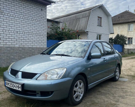 Синій Міцубісі Lancer, об'ємом двигуна 1.58 л та пробігом 230 тис. км за 4900 $, фото 1 на Automoto.ua