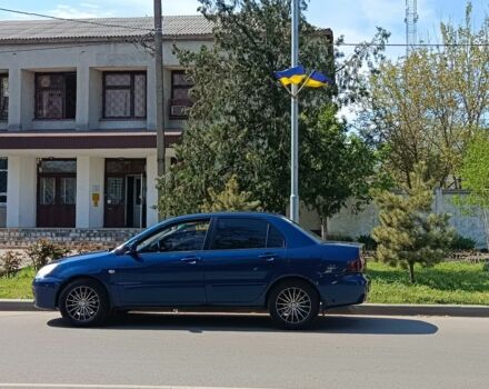 Синий Мицубиси Лансер, объемом двигателя 1.6 л и пробегом 300 тыс. км за 4200 $, фото 1 на Automoto.ua