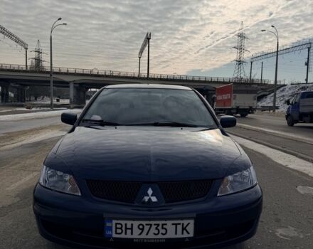 Синий Мицубиси Лансер, объемом двигателя 1.6 л и пробегом 211 тыс. км за 5000 $, фото 1 на Automoto.ua