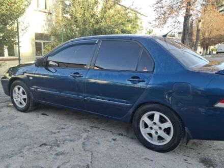 Синій Міцубісі Lancer, об'ємом двигуна 1.6 л та пробігом 338 тис. км за 2912 $, фото 1 на Automoto.ua