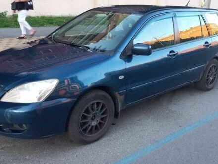 Синій Міцубісі Lancer, об'ємом двигуна 1.6 л та пробігом 245 тис. км за 3299 $, фото 1 на Automoto.ua