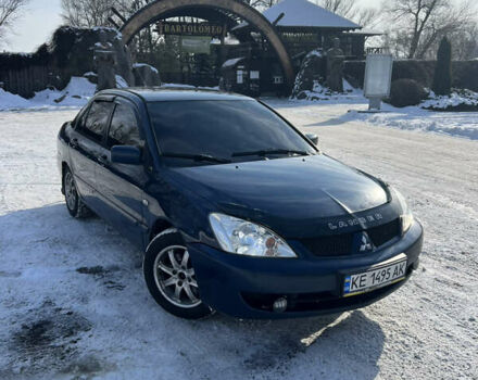 Синий Мицубиси Лансер, объемом двигателя 1.58 л и пробегом 320 тыс. км за 3000 $, фото 1 на Automoto.ua