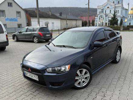 Синий Мицубиси Лансер, объемом двигателя 2 л и пробегом 326 тыс. км за 5650 $, фото 1 на Automoto.ua