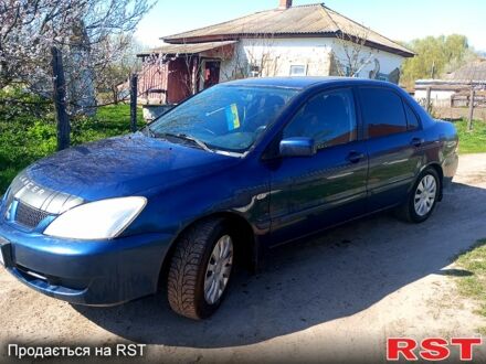 Синій Міцубісі Lancer, об'ємом двигуна 1.6 л та пробігом 450 тис. км за 3999 $, фото 1 на Automoto.ua