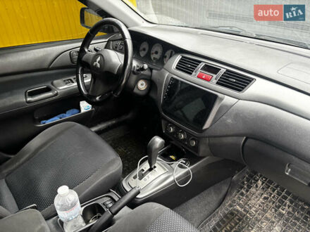 Синий Мицубиси Лансер, объемом двигателя 1.6 л и пробегом 360 тыс. км за 5000 $, фото 1 на Automoto.ua