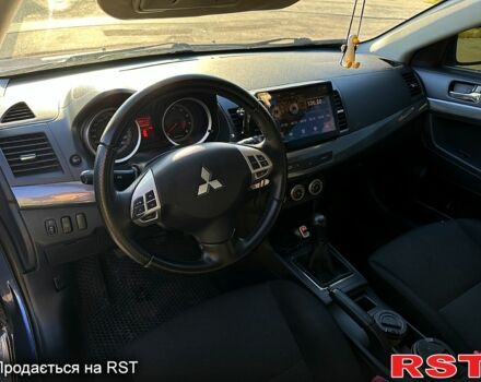 Синий Мицубиси Лансер, объемом двигателя 2 л и пробегом 25000 тыс. км за 6000 $, фото 1 на Automoto.ua