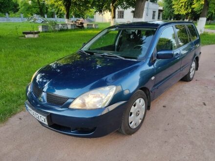 Синій Міцубісі Lancer, об'ємом двигуна 1.6 л та пробігом 198 тис. км за 3900 $, фото 1 на Automoto.ua